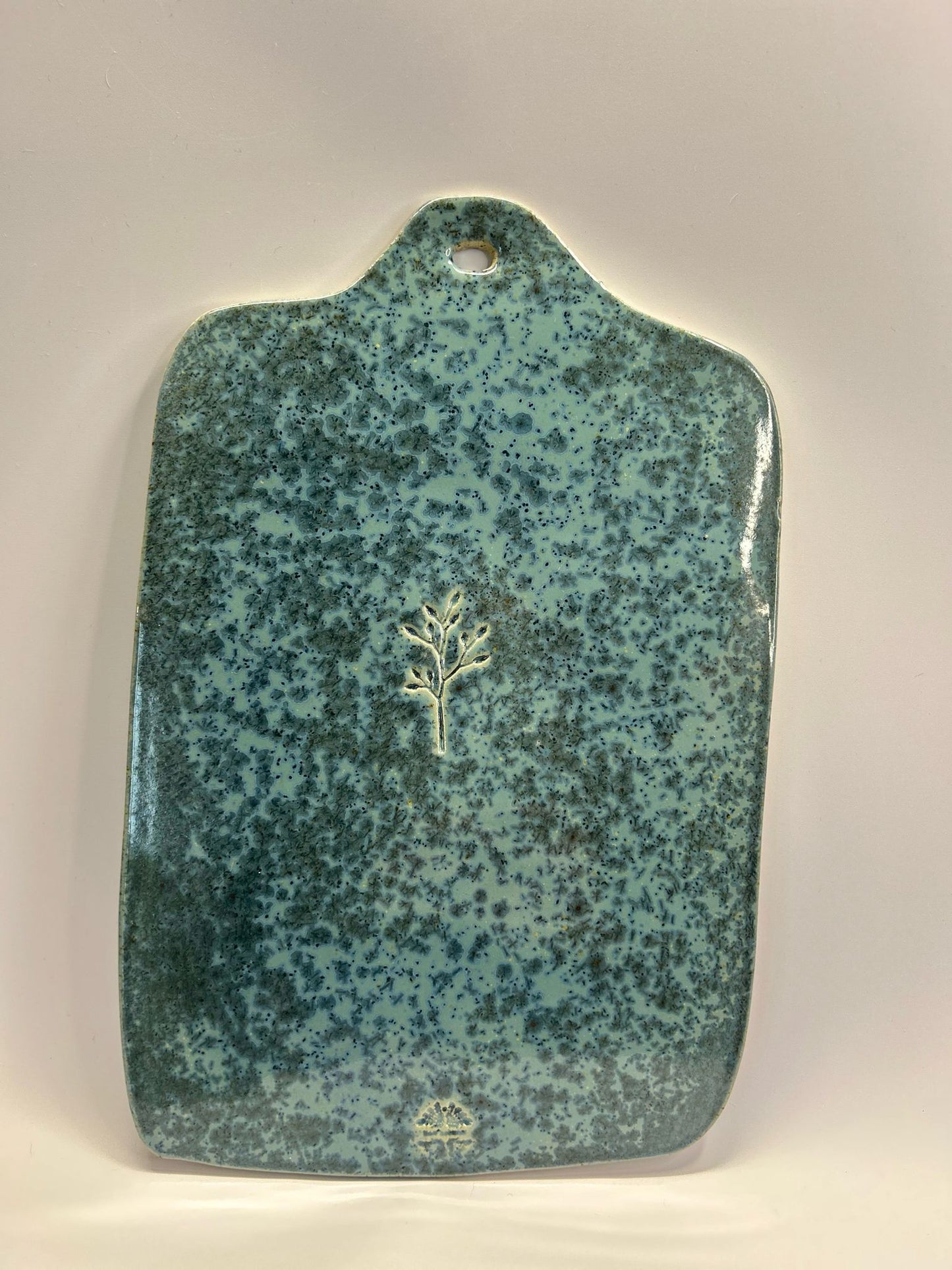 Planche décorative en céramique bleue