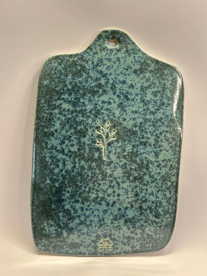 Planche décorative en céramique bleue